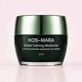 KOS-MARA Herbal Calming Moisturizer in a 50 mL dark green jar with a metallic green lid, set against a soft pink background.