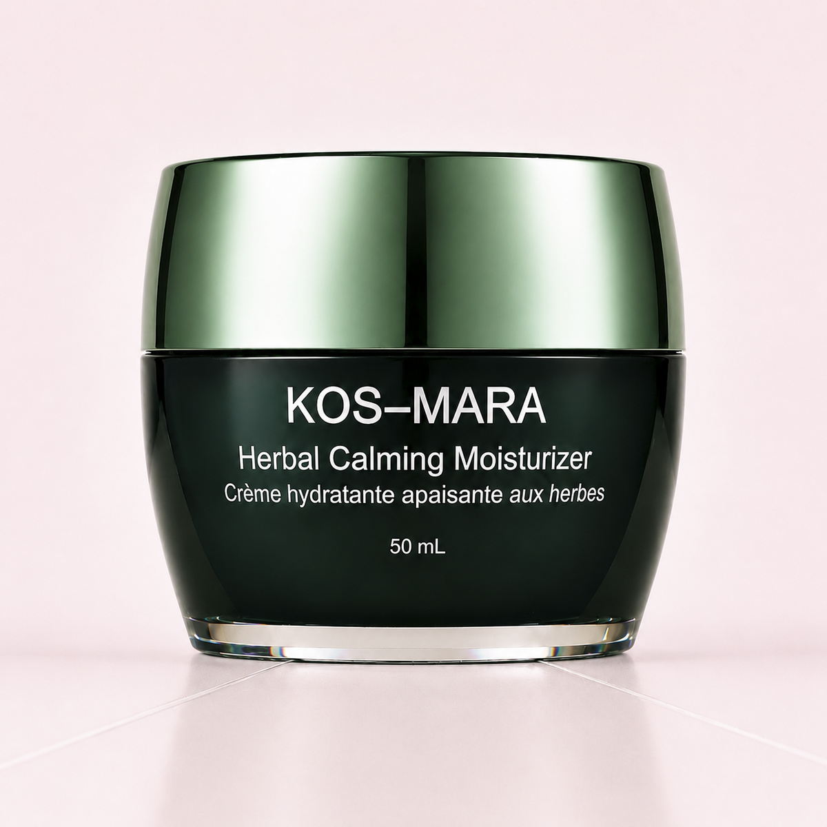 KOS-MARA Herbal Calming Moisturizer in a 50 mL dark green jar with a metallic green lid, set against a soft pink background.